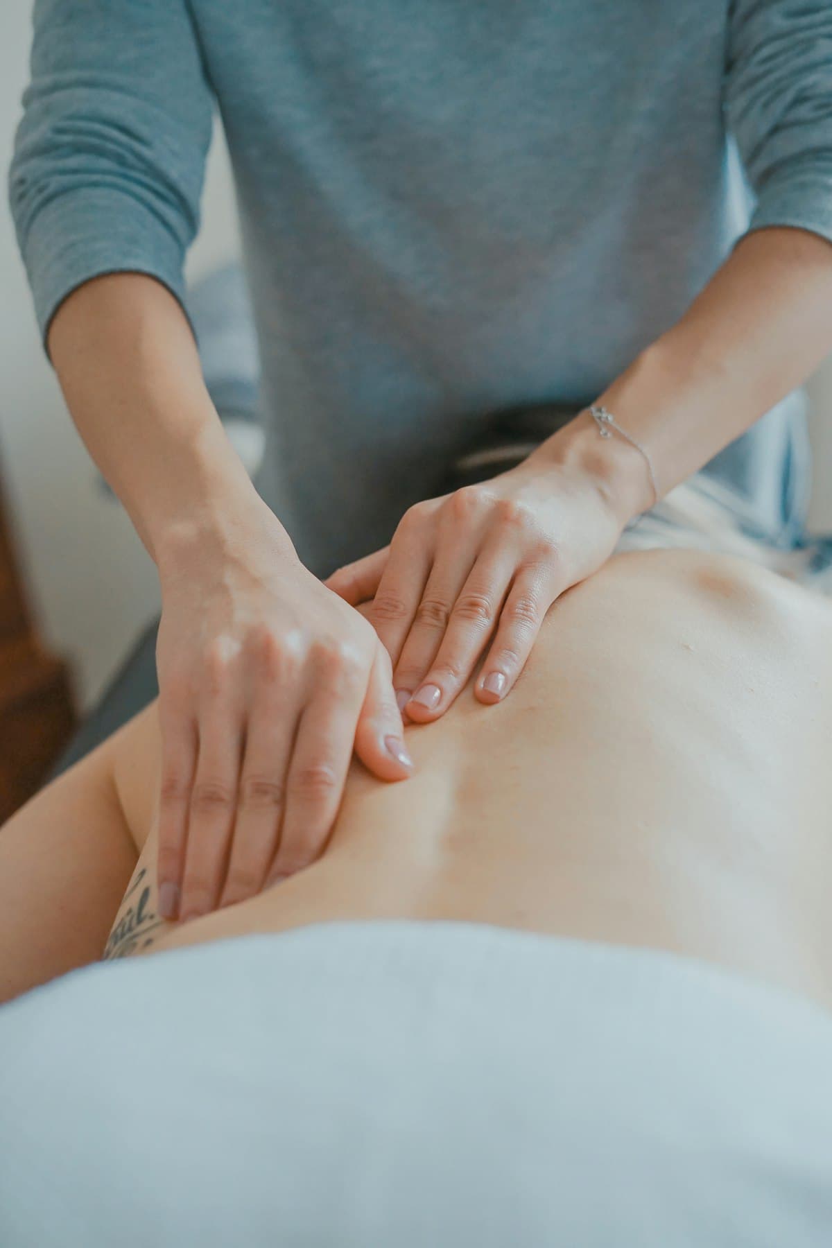 Therapeutic deep tissue massage relieving back and shoulder tension